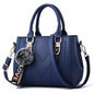 Sac à bandoulière brodé en cuir – Femme