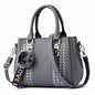 Sac à bandoulière brodé en cuir – Femme